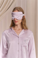White and light purple rhinestone eye mask from Not Just Pajama, a stylish loungewear accessory with sparkling embellishments.