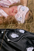 Pink Not Just Pajama eye mask, soft loungewear accessory with smooth fabric and comfortable fit for relaxing or sleep.