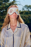 Pearl white embroidered eye mask from Not Just Pajama, soft loungewear accessory with delicate embroidery for comfortable relaxation.