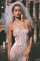 White Elsa lace midi dress by Nana Jacqueline featuring intricate lace details and a elegant, flowing silhouette.