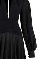 Black chiffon maxi gown with puffed sleeves and corset details from CEM, elegant and flowing for formal events.