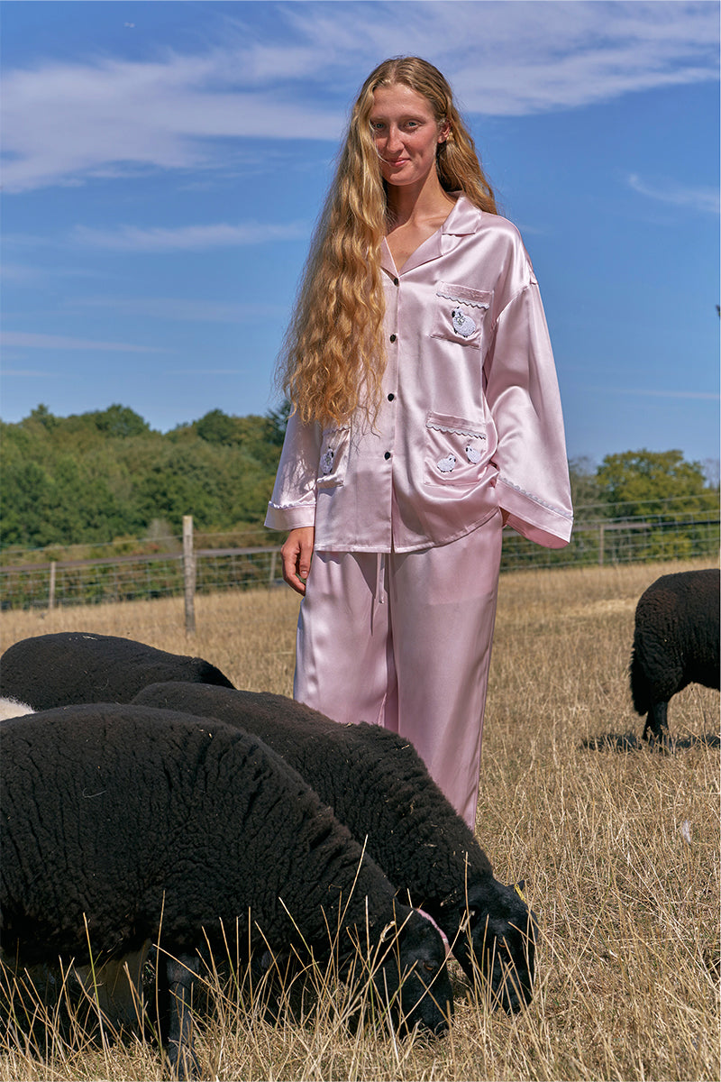 Pink plush trim long pajamas set by Not Just Pajama, featuring soft fabric and cozy design for comfortable sleepwear.