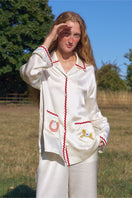 Pearl white contrast wave-trim long pajama set from Not Just Pajama, featuring comfortable fabric and stylish design.