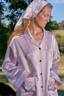 Pink plush-trim long pajamas set by Not Just Pajama, featuring soft fabric and comfortable fit.