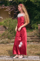 Bias-cut burgundy maxi dress by Not Just Pajama featuring rhinestones and feather details, perfect for elegant occasions.