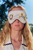 Pearl white embroidered eye mask from Not Just Pajama, soft loungewear accessory with delicate embroidery and comfortable fabric.