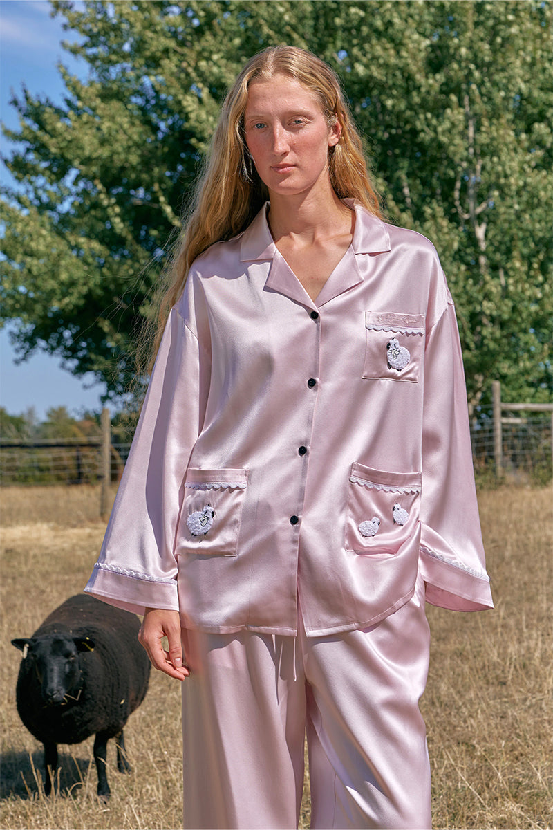 Pink plush trim long pajamas set by Not Just Pajama, featuring cozy fabric and relaxed fit, perfect for comfortable sleepwear.