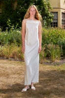 White bias-cut slip dress with rhinestones and feather details, designed by Not Just Pajama, featuring a flowing maxi dress silhouette.