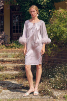 Light purple feather and rhinestone short robe from Not Just Pajama, styled as a midi dress with delicate feather details.