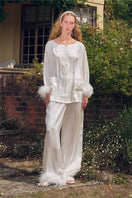 White feather long-sleeve pajamas set with rhinestone accents, stylish and comfortable by Not Just Pajama.