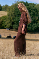 Brown long sleeve unisex knitwear shirt by Not Just Pajama, featuring a cozy, fitted design with ribbed cuffs and collar.