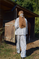 Blue print twill long pajamas set from Not Just Pajama, featuring a comfortable button-up top and matching pants.
