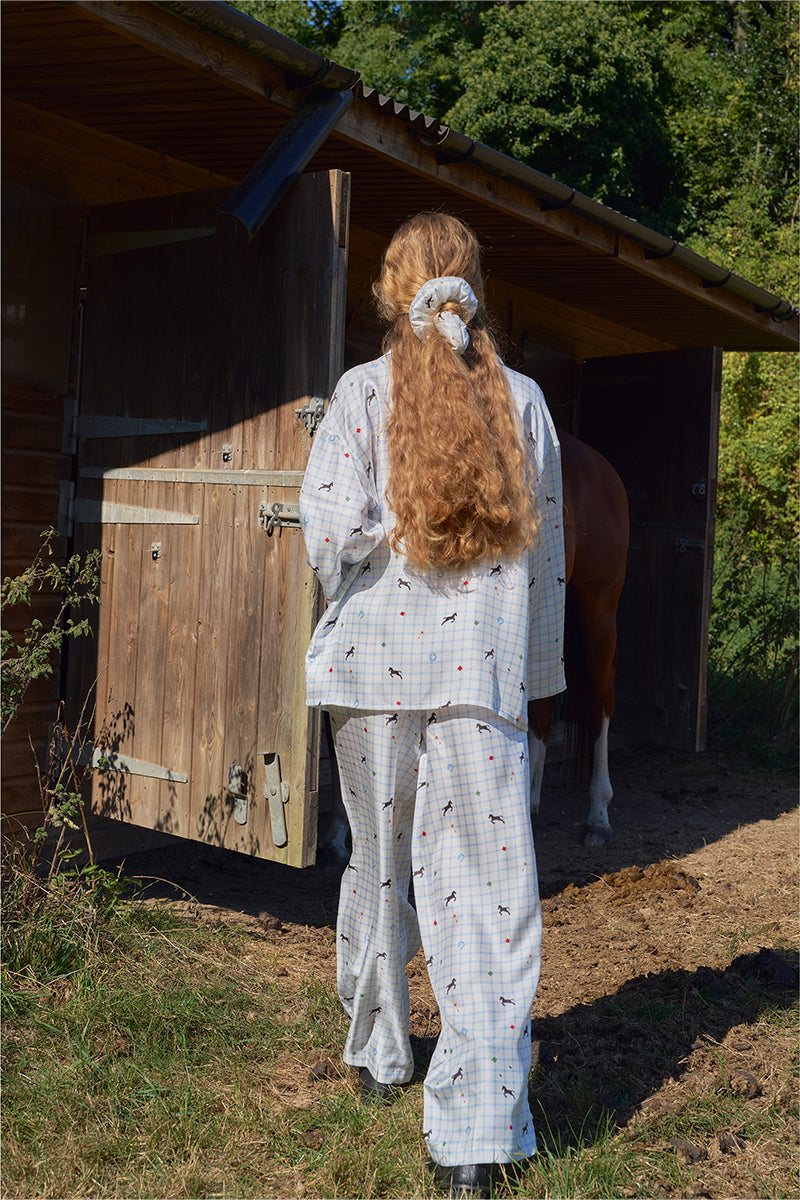 Blue print twill long pajamas set from Not Just Pajama, featuring a comfortable button-up top and matching pants.
