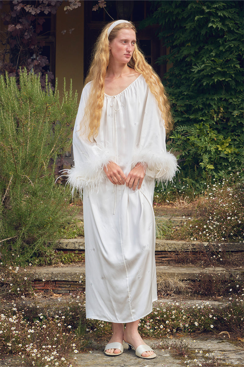 White feather robe with rhinestones, luxurious gown by Not Just Pajama featuring delicate feather details and elegant design.