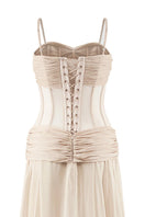 CEM nude chiffon maxi gown with a long, flowing silhouette and elegant corset-style bodice, perfect for formal occasions.