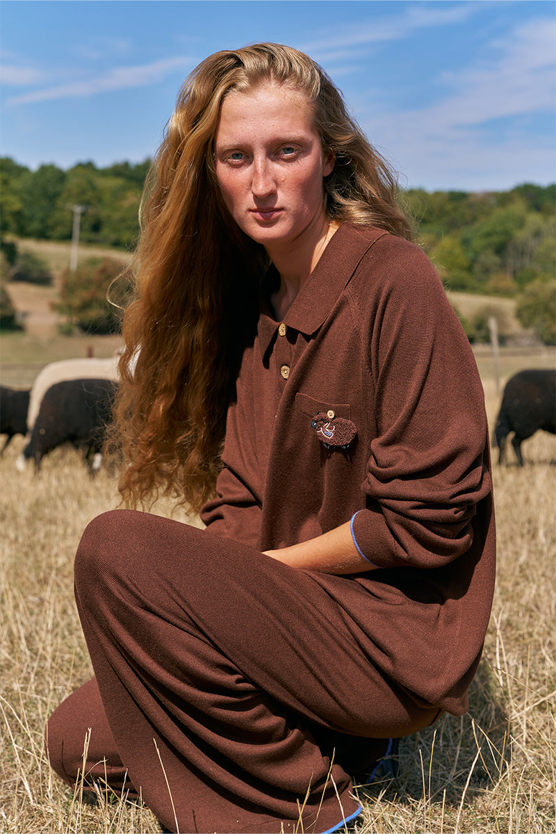 Brown long sleeve unisex knitwear shirt by Not Just Pajama, featuring a cozy, fitted knit design with a ribbed collar and cuffs.