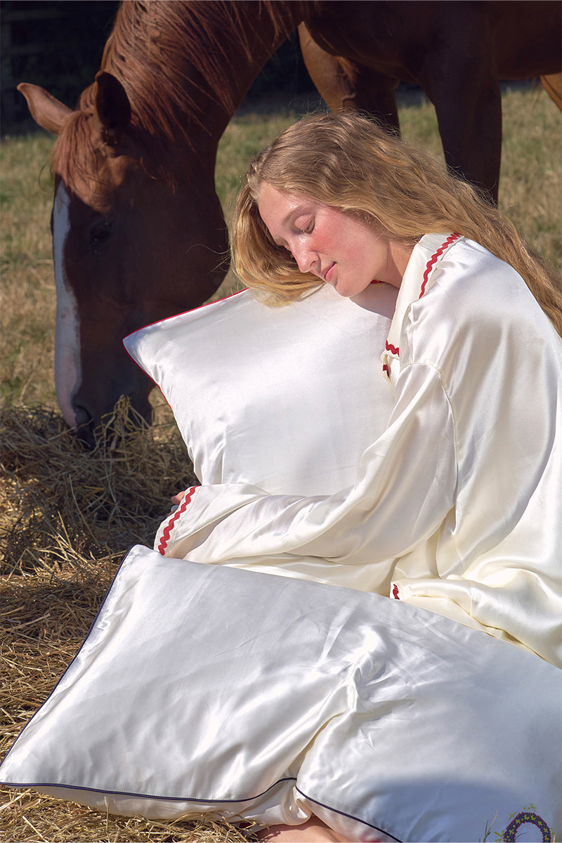 Pearl white loungewear pillowcase from Not Just Pajama, soft fabric with smooth finish, designed for comfortable sleep and relaxation.