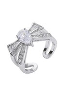Nana Jacqueline CLAIRA ring featuring a sleek, modern design with a gold finish, displayed on a white background.