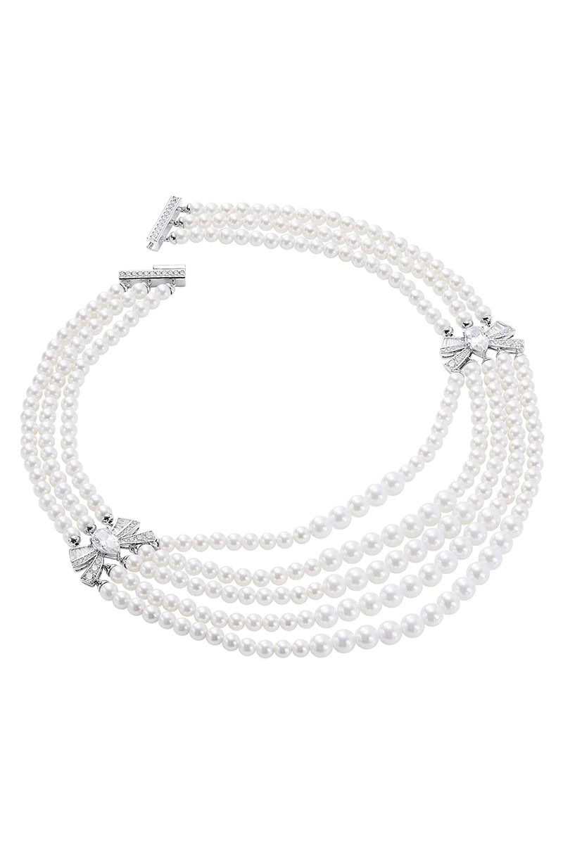 Elegant Maxine Necklace by Nana Jacqueline featuring intricate silver chain design and delicate pendant on a neutral background.