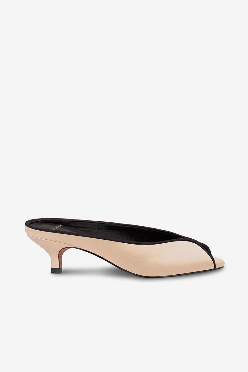 Black AQUILA heels in sand color by 10TH FLOOR, stylish high heels with sleek design, photographed on a neutral background.