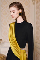 Black round neckline gown with one-shoulder fringe silk design by I.H.F, featuring elegant draped fabric and sophisticated style.