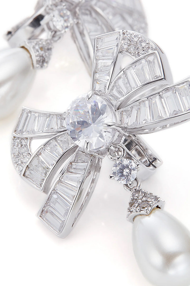 Evelyn earrings by Nana Jacqueline featuring elegant gold-tone earrings with intricate detailing and hoop design.
