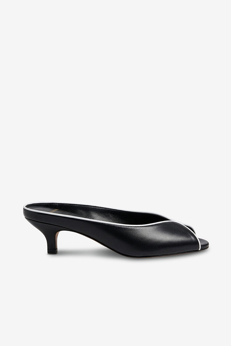 Black AQUILA heels by 10TH FLOOR, stylish women's high heels with sleek design and pointed toes.
