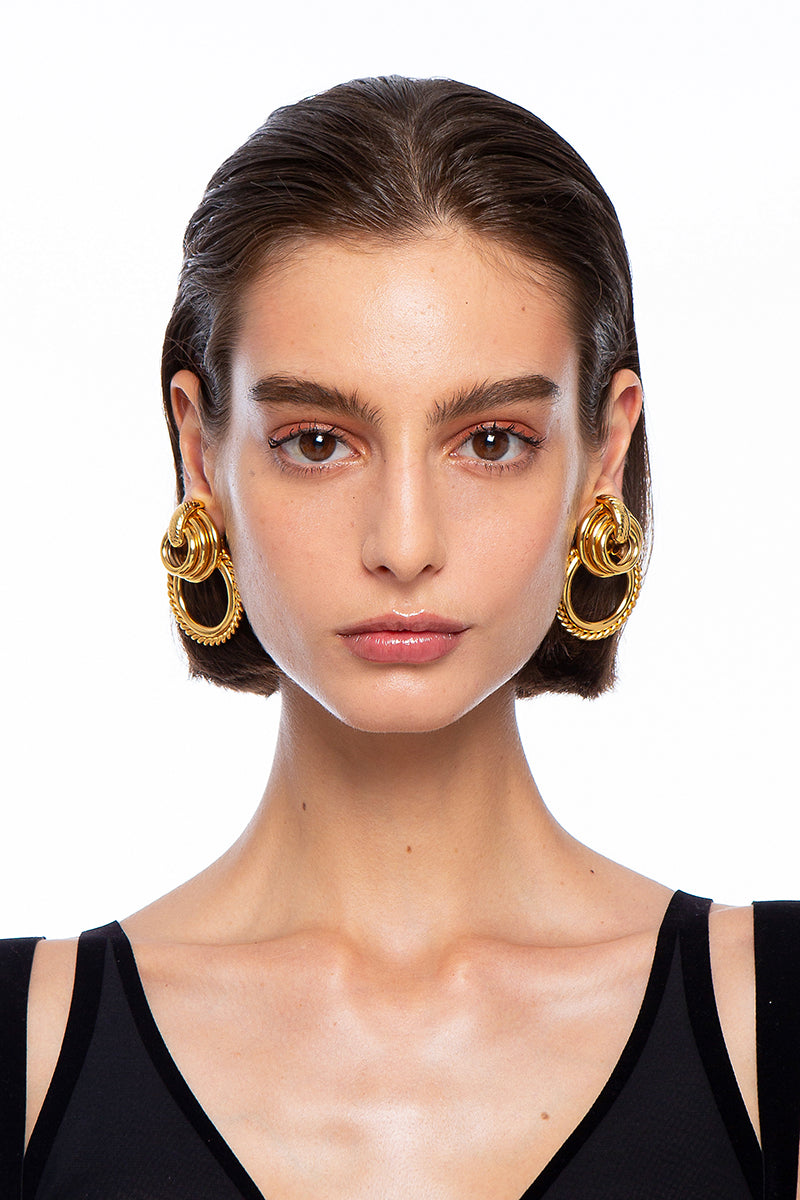 Silvia Gnecchi GABY gold earrings, stylish and elegant earrings with a polished gold finish, displayed against a neutral background.