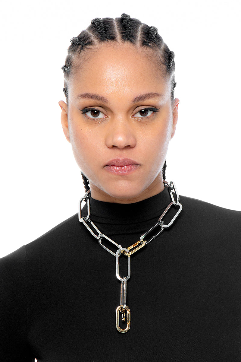 Silver "The Thing" necklace by Silvia Gnecchi featuring a sleek, modern design with a polished finish on a delicate chain.
