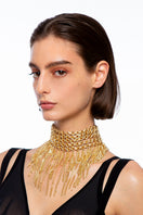 Silvia Gnecchi Dalida Gold Necklace featuring delicate chain and elegant pendant on a plain background