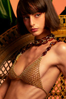 Silvia Gnecchi caramel gold bra tops with smooth fabric and delicate straps, displayed on a neutral background.