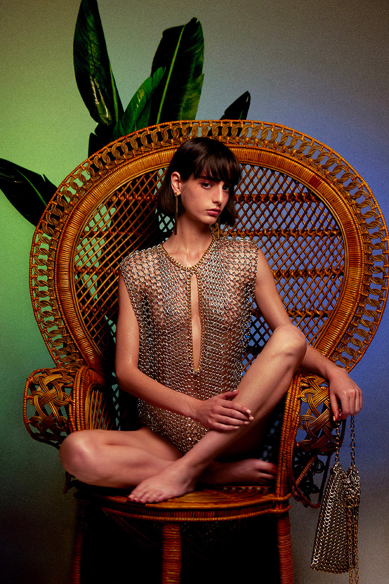 Silver and gold chain vest from Silvia Gnecchi's LOULOU collection, worn as a stylish top with layered chain details.