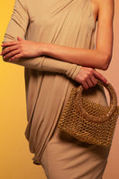 Silvia Gnecchi Luna Chain Bag, a stylish top handle bag with a gold chain strap and elegant design, on a neutral background.