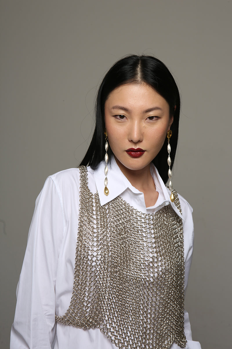 Silver Sofia top by Silvia Gnecchi, featuring a stylish sleeveless design with elegant detailing, perfect for layered looks.