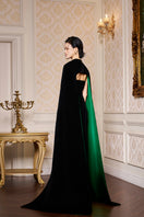 Black strapless velvet gown with a long cape, designed by I.H.F, featuring a fitted bodice and flowing dramatic cape.