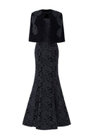 Black princess line strapless gown with a cape from I.H.F, featuring a fitted bodice and flowing skirt.