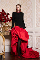 Elegant I.H.F gown with a high neckline and draped taffeta hem, showcasing luxurious fabric and sophisticated design.