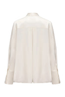 Nana Jacqueline Louisa Top in soft fabric with a stylish neckline, displayed on a neutral background.