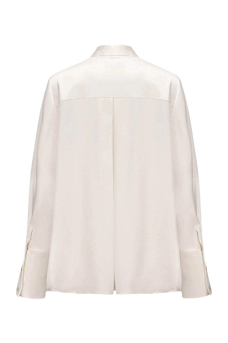 Nana Jacqueline Louisa Top in soft fabric with a stylish neckline, displayed on a neutral background.