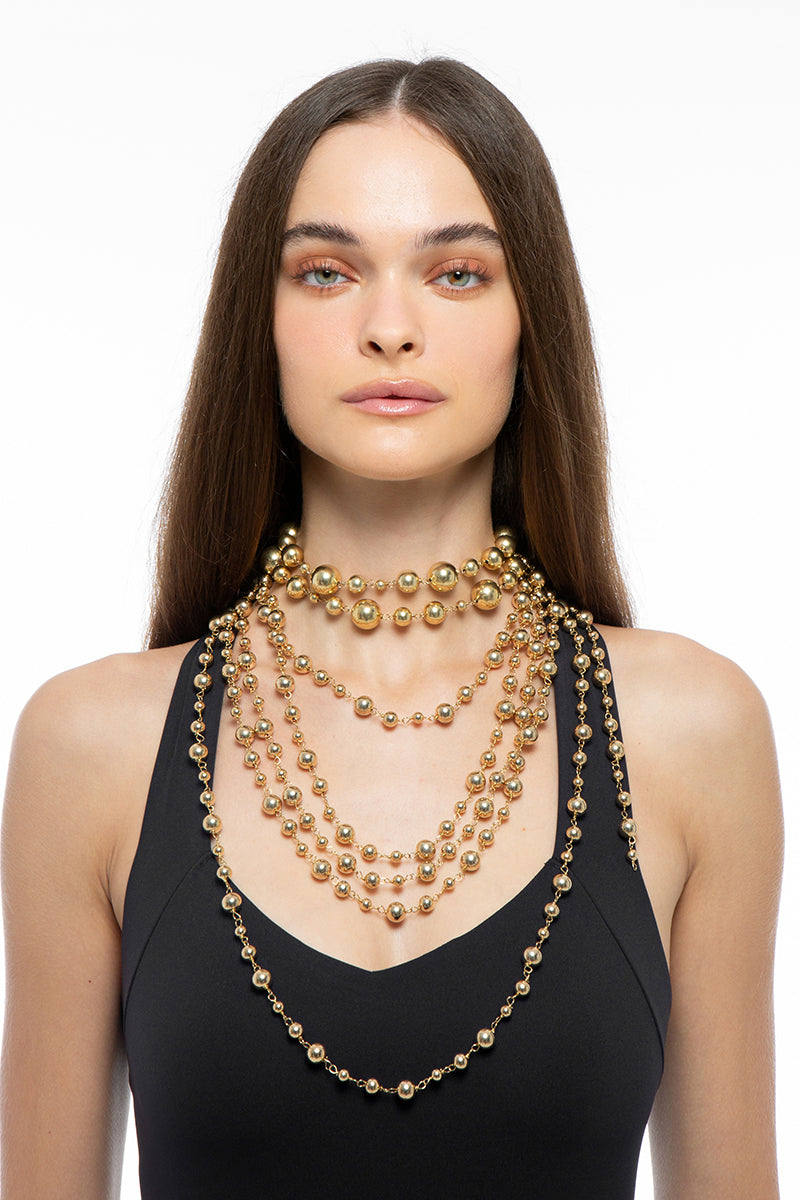Gold necklace from Silvia Gnecchi's Solange collection, featuring elegant design and intricate details.