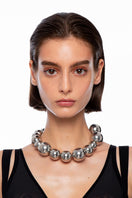 Silver Yaba necklace by Silvia Gnecchi, featuring a sleek, elegant design with a polished silver finish.