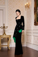 Black Queen Anne neckline velvet gown with draped waist by I.H.F, featuring elegant design and luxurious fabric.