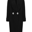 Nana Jacqueline Audrina black coat with tailored fit, shown hanging on a wooden hanger with a background of neutral tones.