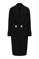 Nana Jacqueline Audrina black coat with tailored fit, shown hanging on a wooden hanger with a background of neutral tones.