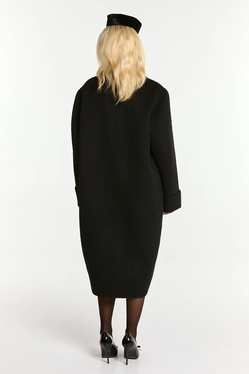 Black Audrina coat by Nana Jacqueline showcasing a stylish, tailored coat with a sleek silhouette and classic design.