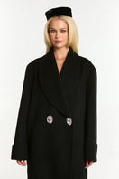 Black Audrina coat by Nana Jacqueline featuring a tailored design and classic silhouette, shown on a model.