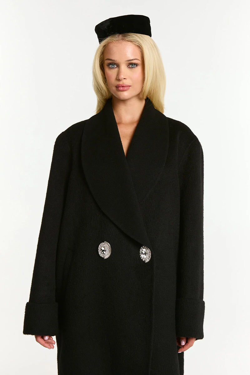 Black Audrina coat by Nana Jacqueline featuring a tailored design and classic silhouette, shown on a model.