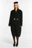 Black Audrina coat by Nana Jacqueline, stylish long coat with tailored fit and button details, shown on a model.