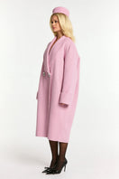Pink Audrina coat by Nana Jacqueline, stylish winter coat with a tailored fit and elegant design, displayed on a hanger.
