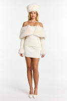 Nana Jacqueline Nadine Top in a stylish, fitted design with a v-neck and long sleeves, shown in a neutral color.
